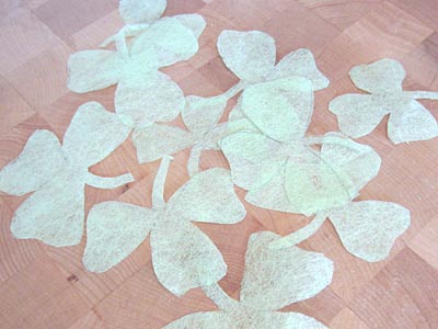 These tissue paper shamrocks are made with bits of scrap paper we had in the house. We used it to make shamrock branches for Saint Patrick's Day.