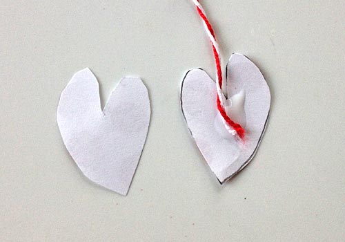 Our upcycled Paper Heart Mobile kids craft is full of love and sweet vibes! Perfect for a little girl's room or as a homemade Valentine's Day decoration!