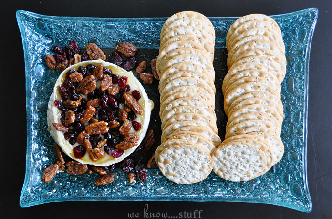 This super easy Barbecue Brie Recipe is incredibly delicious and just so gosh darn easy to make, you'll smack yourself upside the head for not thinking of it sooner. Top it with local honey, dried cranberries and nuts for the perfect summer appetizer!
