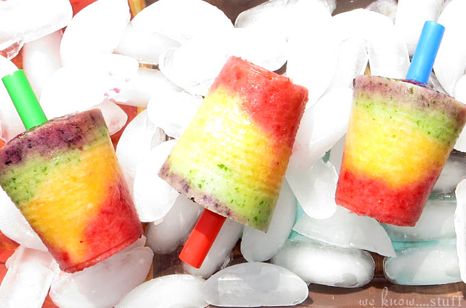 In order to avoid lots of unwanted dyes and added sugar, I make my own homemade rainbow fruit popsicles! Full of fruit & yogurt, they're a healthy treat!