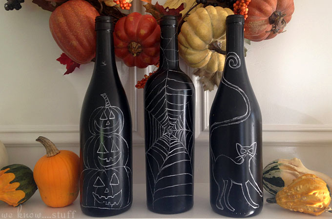 Have you ever wondered what to do with your leftover wine bottles? Our Halloween Wine Bottle craft uses black paint and chalk to create awesome decorations!