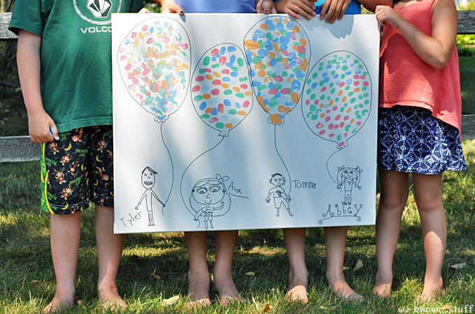  This DIY canvas wall art project is a simple, cheap way to add original artwork to your home. Caricatures of the kids and thumbprint balloons keep it sweet. 