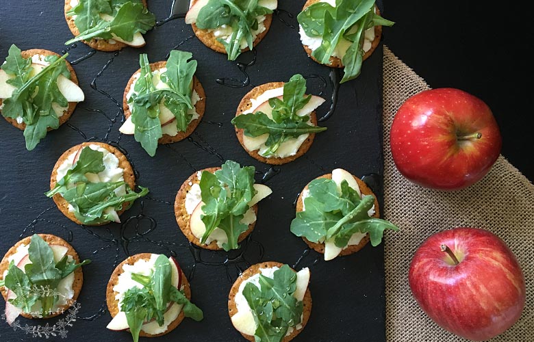 This Goat Cheese Arugula Apple Garnish is a super simple way to elevate a cracker appetizer. Full of fresh ingredients and a drizzle of honey, it's delish!