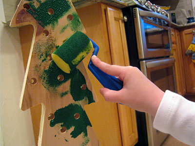 This Christmas Tree craft for kids uses wood trees with pre-drilled holes from Michaels. Once painted, they make great keepsake decorations. This Christmas Tree craft for kids uses wood trees with pre-drilled holes from Michaels. Once painted, they make great keepsake decorations.
