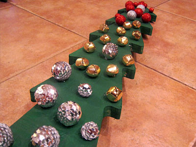 This Christmas Tree craft for kids uses wood trees with pre-drilled holes from Michaels. Once painted, they make great keepsake decorations. This Christmas Tree craft for kids uses wood trees with pre-drilled holes from Michaels. Once painted, they make great keepsake decorations.