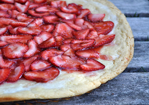 Are you looking for an easy summer dessert recipe? This Sugar Cookie Strawberry Pizza is made with cookie dough and is a great cooking with kids activity!