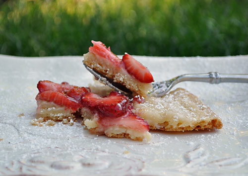 Are you looking for an easy summer dessert recipe? This Sugar Cookie Strawberry Pizza is made with cookie dough and is a great cooking with kids activity!